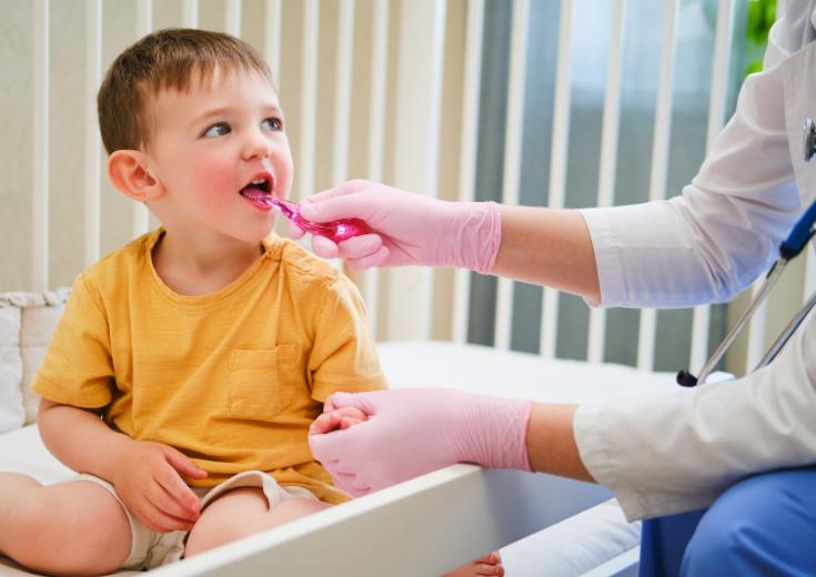 Child being examined by a doctor using virtual dental technology.